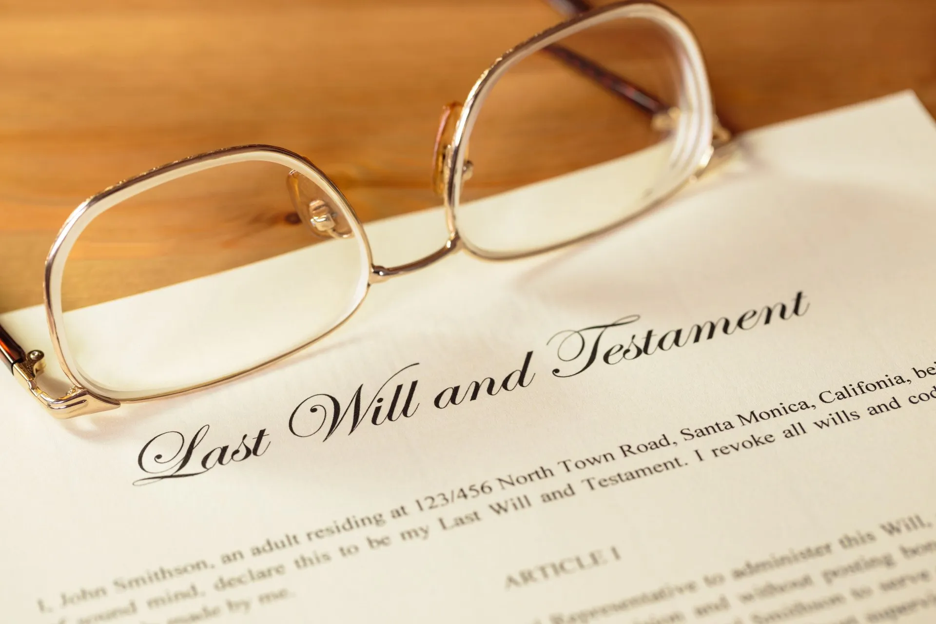 last will and testament form on table with glasses